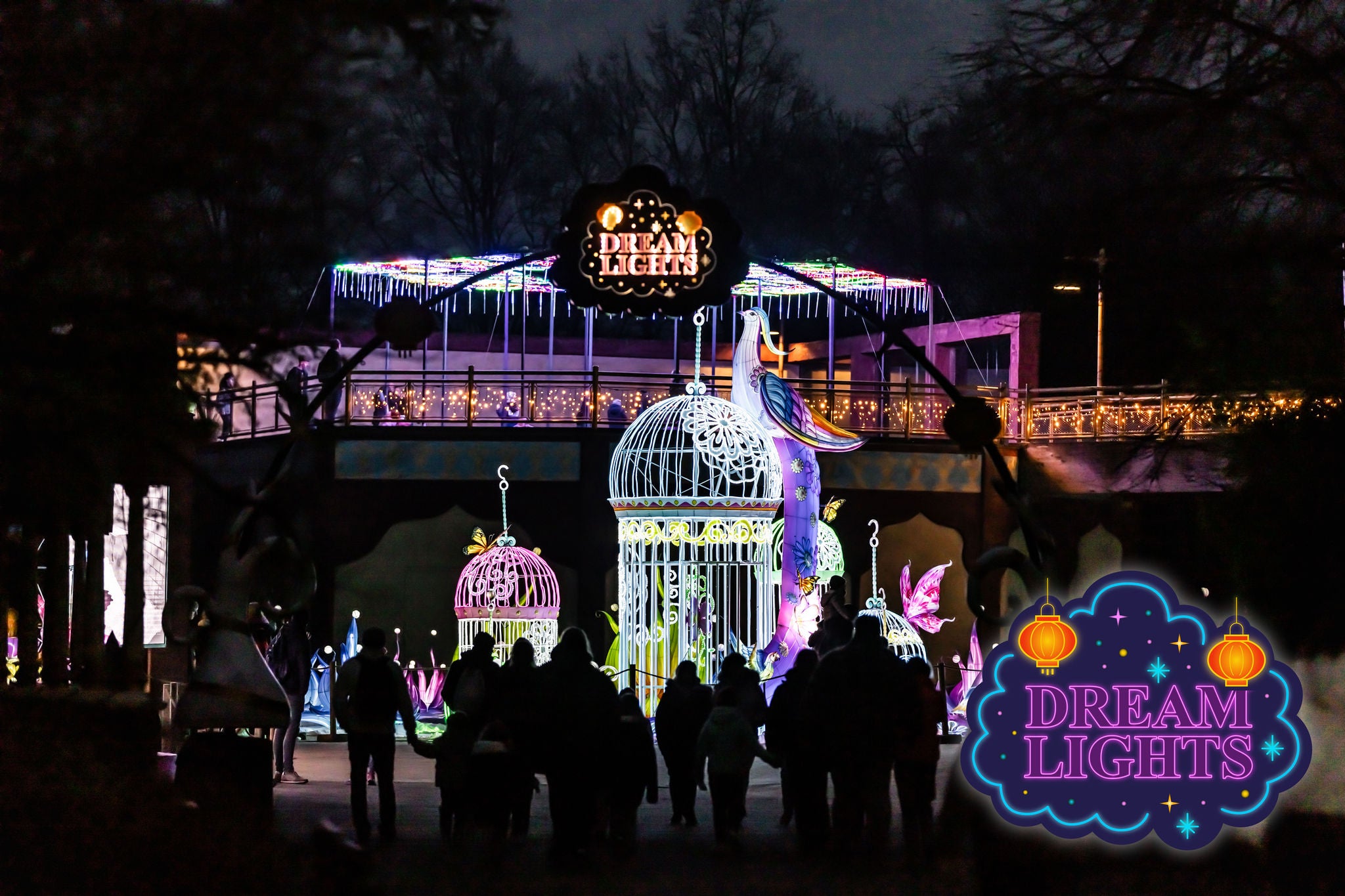 Logo Dream Lights. Lichtgevende kooien, vogel, bloemen en vlinders.